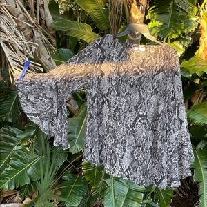 Jennifer Lopez Bell sleeve snakeskin blouse